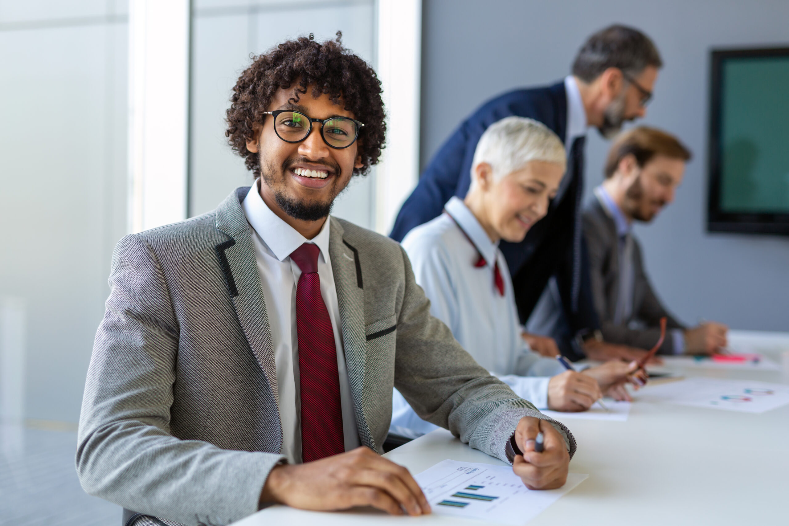 A direct sales professional smiling confidently.